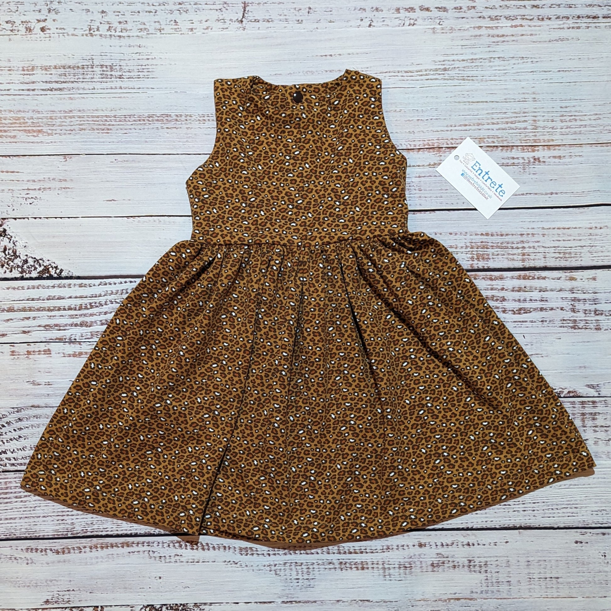 The cool camel leopard print girls dress. Handmade using soft and comfy organic cotton jersey. Shown as a sleeveless dress.