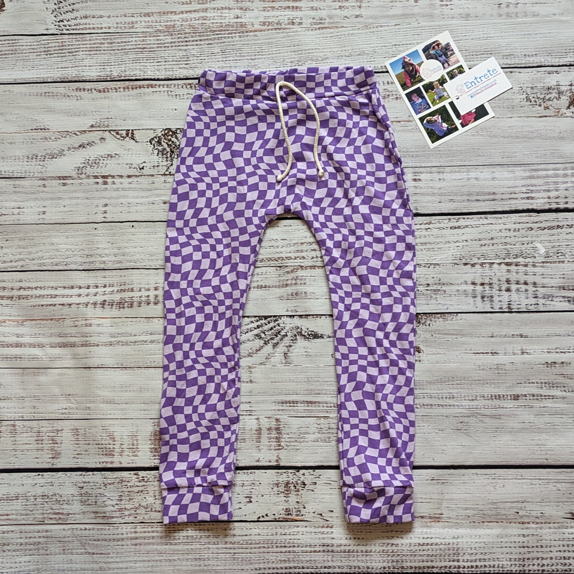 The fab purple trippy checked harem joggers. Handmade from soft and stretchy cotton jersey, with an elasticated waist and roll-able ankle cuffs.