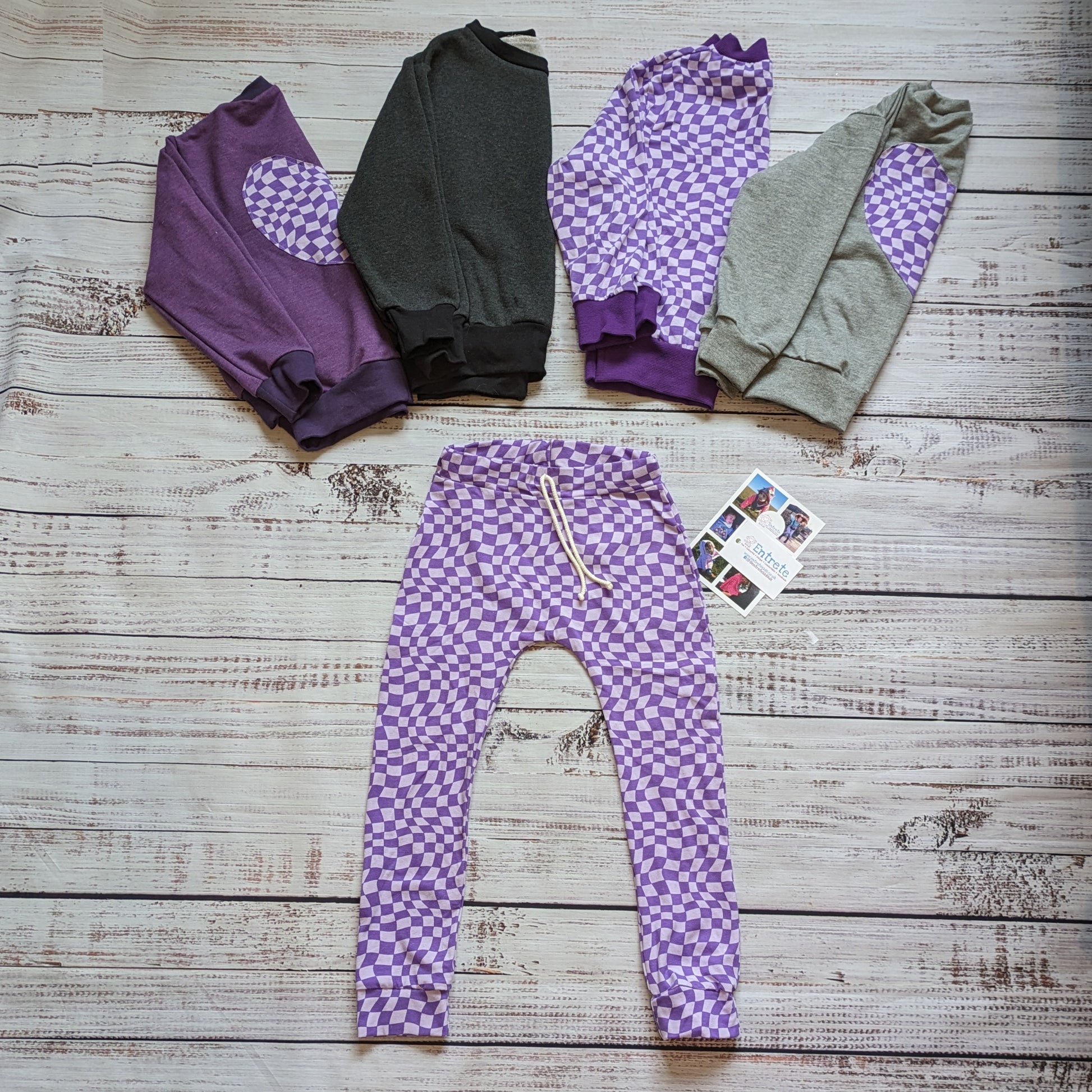 The fab purple trippy checked harem joggers. Shown with matching purple trippy checked heart sweatshirts.