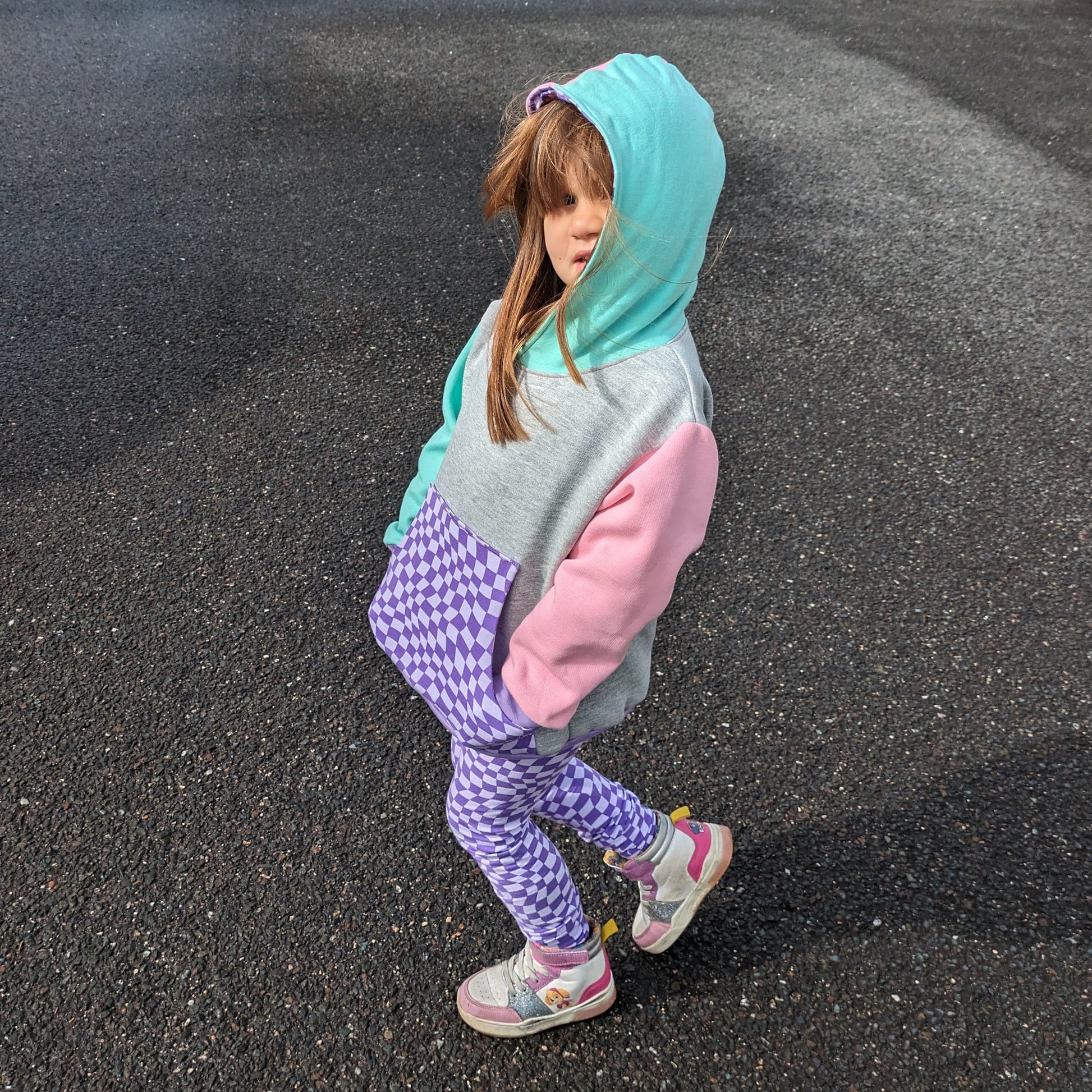 Sophie rocking her purple trippy checked leggings, with a colourful matching hoodie.