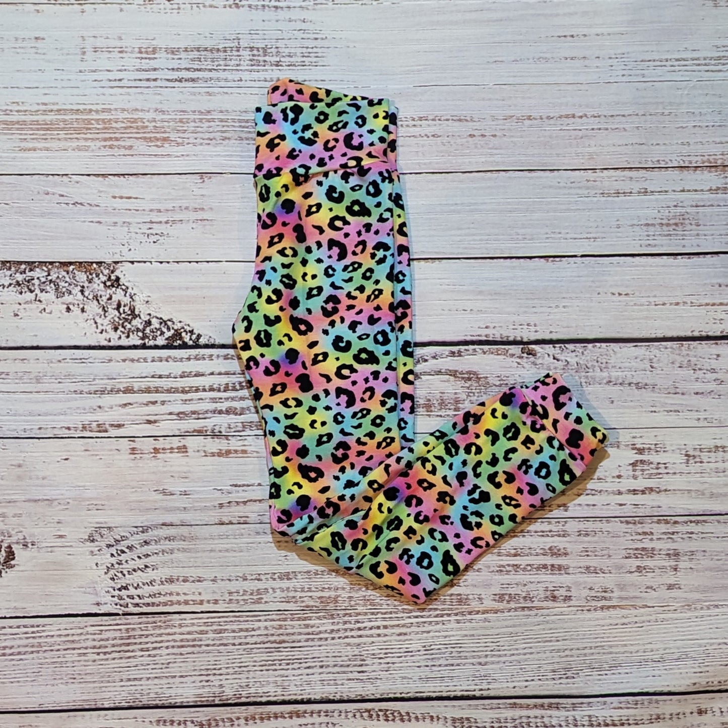 Gorgeous rainbow leopard print child and toddler leggings. Handmade using rainbow leopard print cotton jersey. Shown folded.