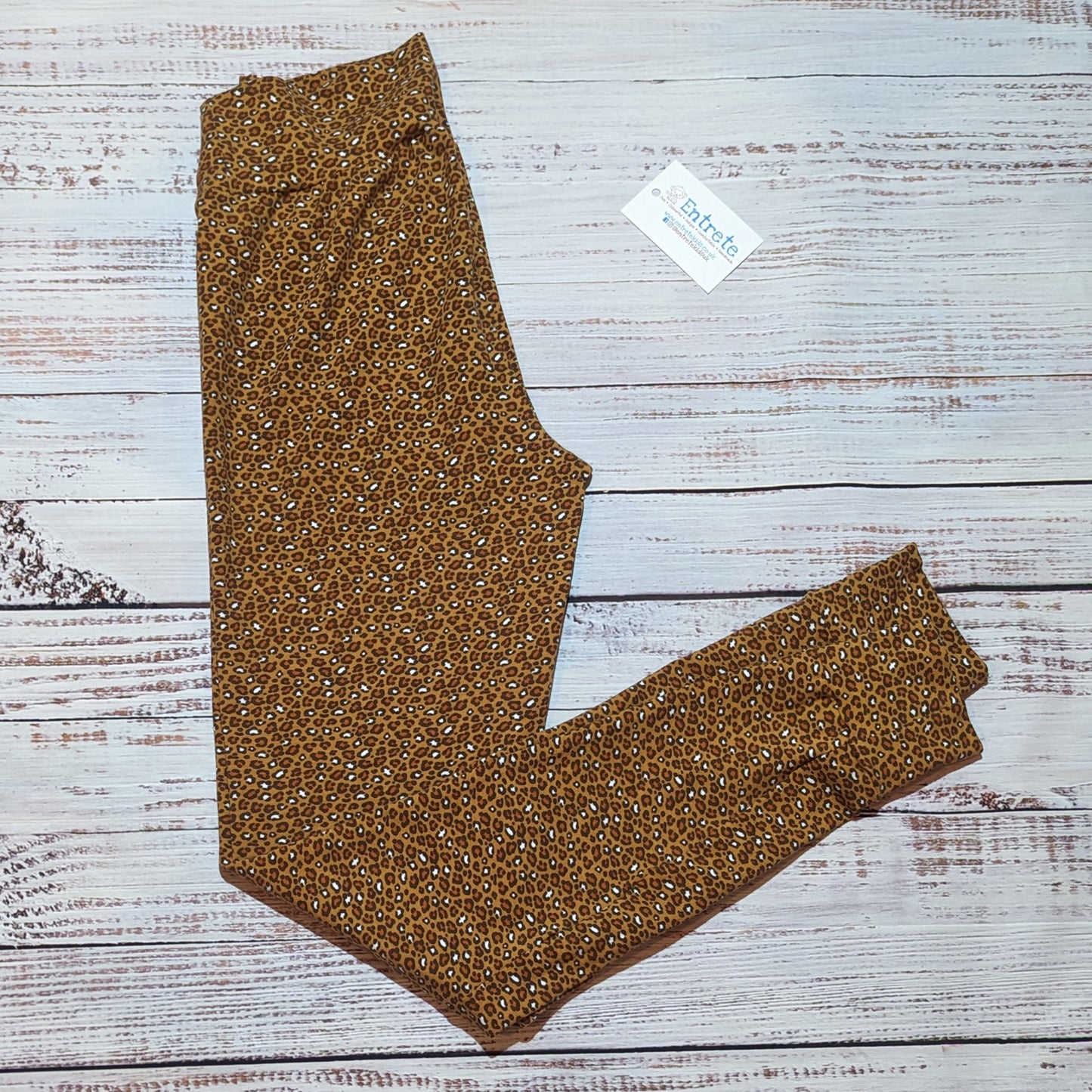 Stylish women's animal print leggings. Handmade using soft and stretchy camel leopard print leggings. Shown folded.