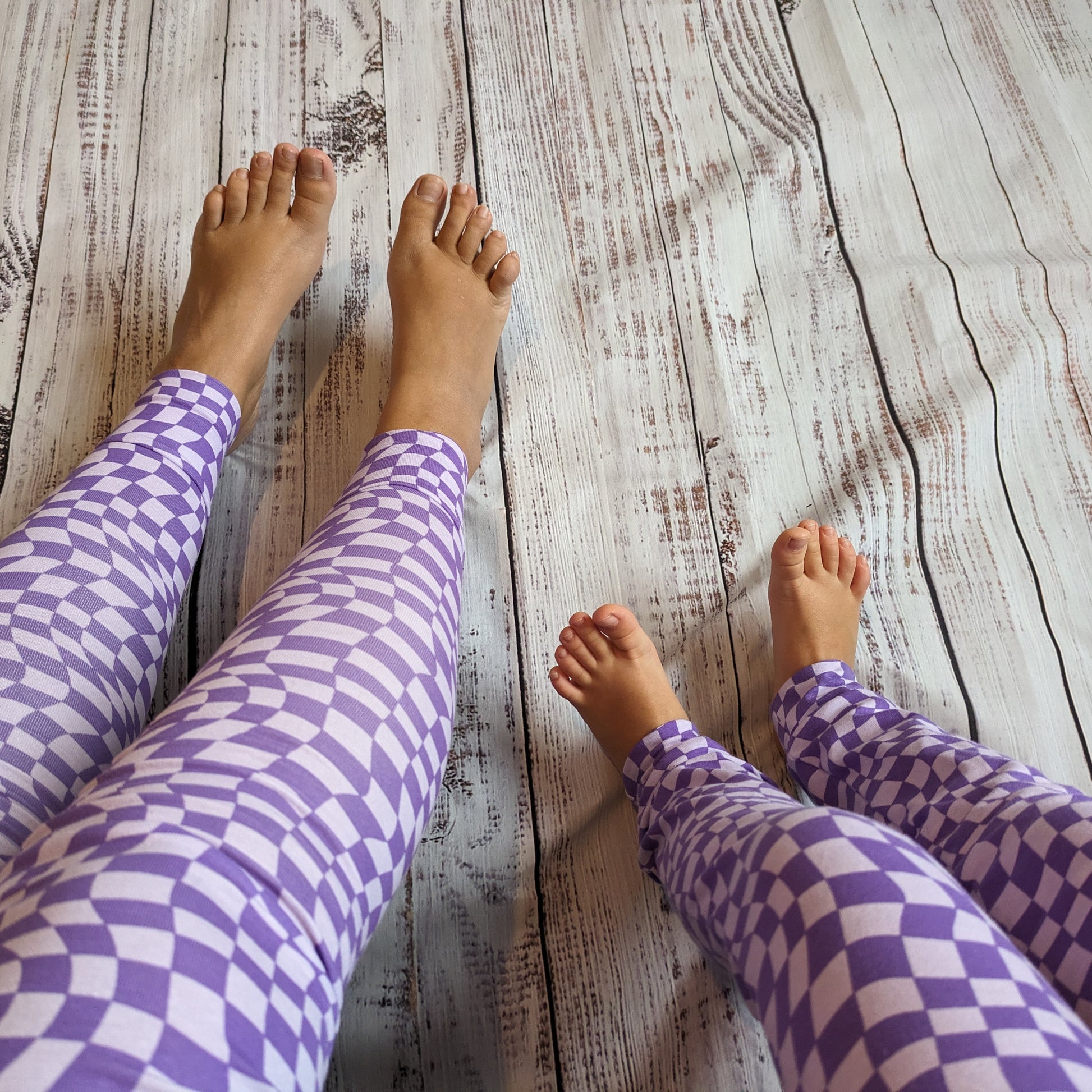 Sophie and Carol showing off there purple trippy checked leggings. Available in a Mummy and mini set.