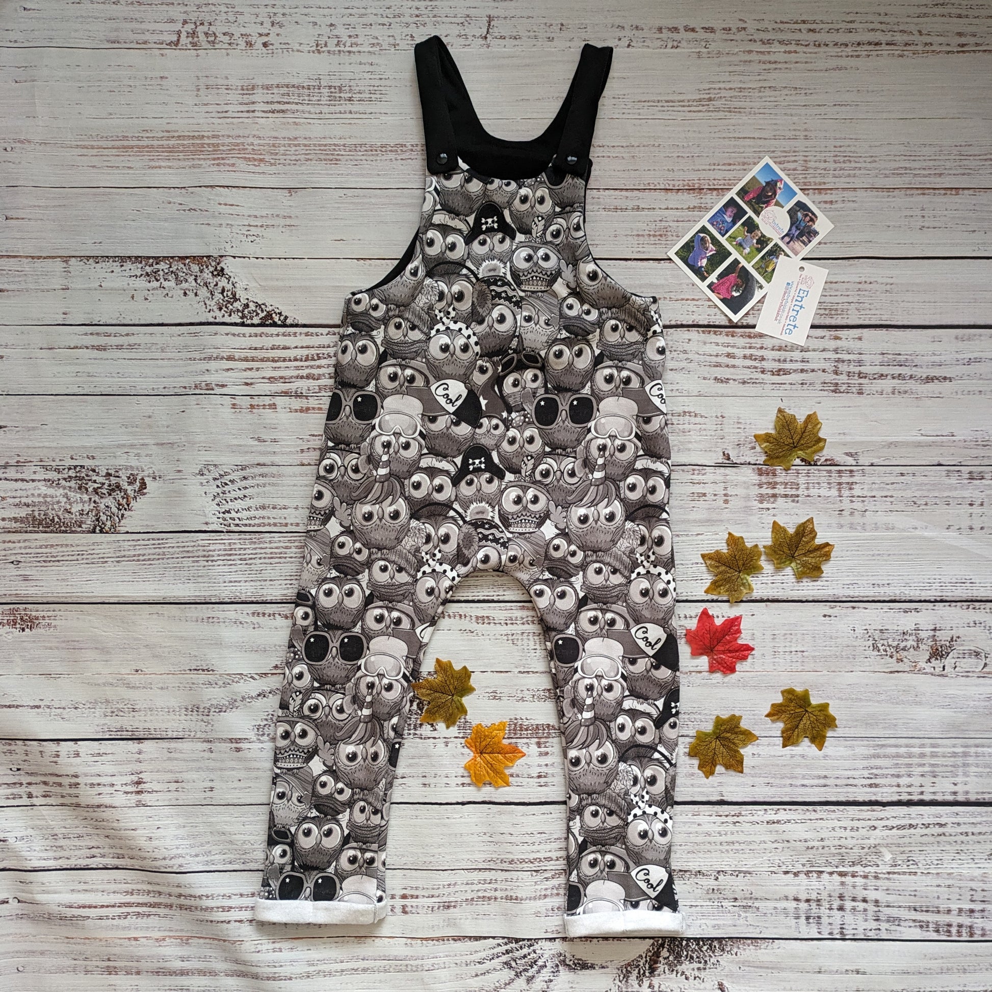 Fun black and white cartoon owls dungarees. Lovingly handmade using monochrome owls cotton sweatshirt fleece and black cotton jersey.