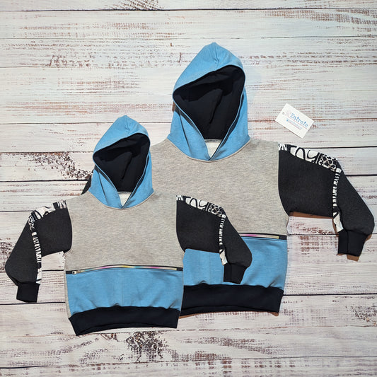 Mama and mini hoodies with zipped front pockets and a sky blue, grey and animal hearts design.