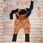 The ferociously fun orange lions bunny romper. Handmade using warm orange lions cotton French terry and black cotton jersey. Featuring front poppers and fun bunny ears on the hood. Shown from the rear.