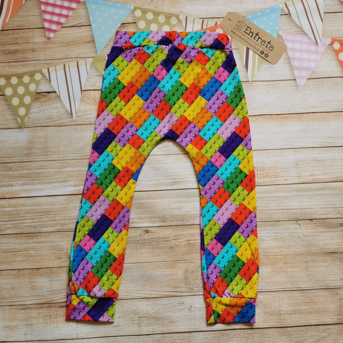 Rear of Colourful building blocks cotton jersey harem joggers.