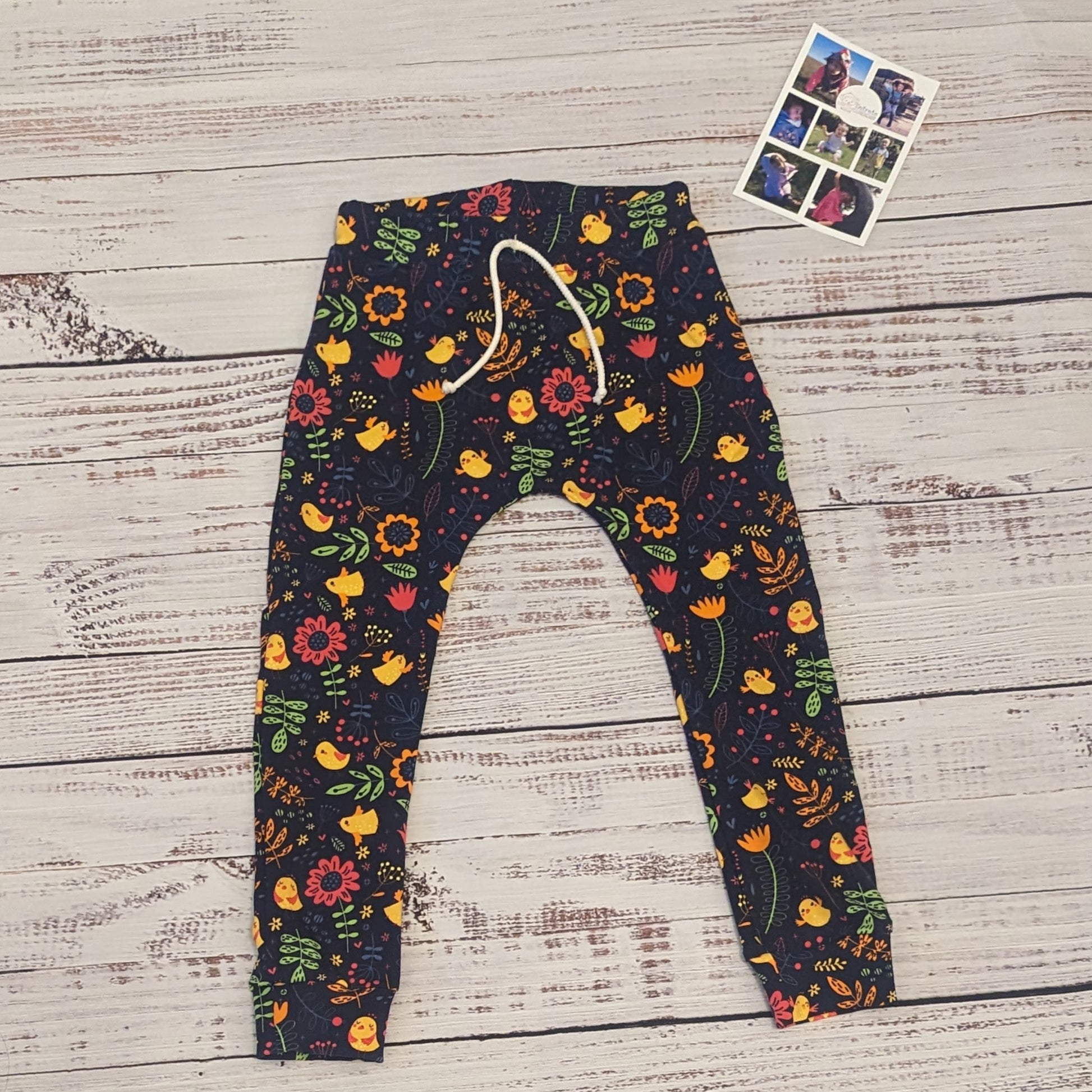 Vibrant and fun flowery chicks kids harem joggers. Handmade using navy chicks cotton jersey.