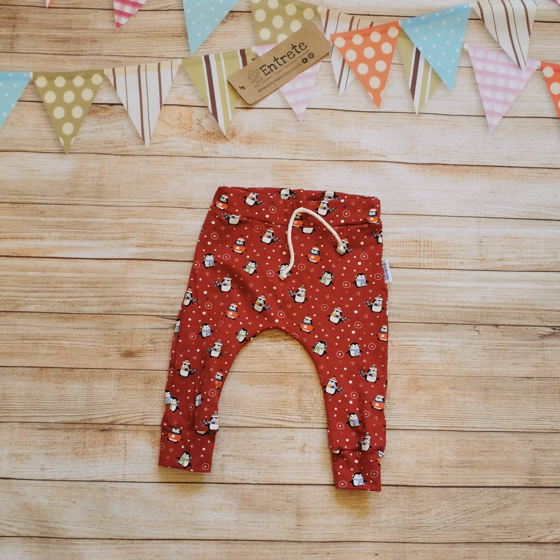 Fun and festive harem joggers handmade using red penguins cotton jersey.