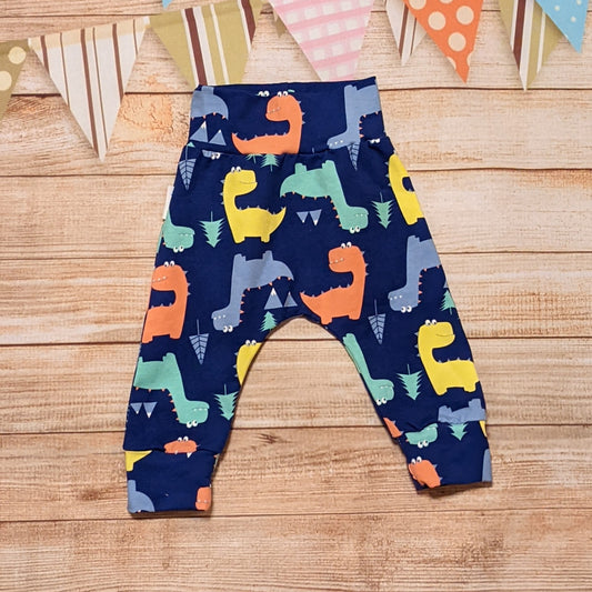 Prehistoric fun with the blue dinosaur harem pants. Handmade using blue dinosaur cotton jersey. Perfect for your little dinosaur fanatic!