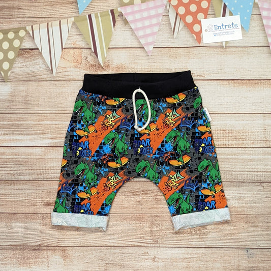 The insanely fun skateboarding dinosaurs harem shorts. Handmade using street dino cotton French terry and black cotton ribbing.