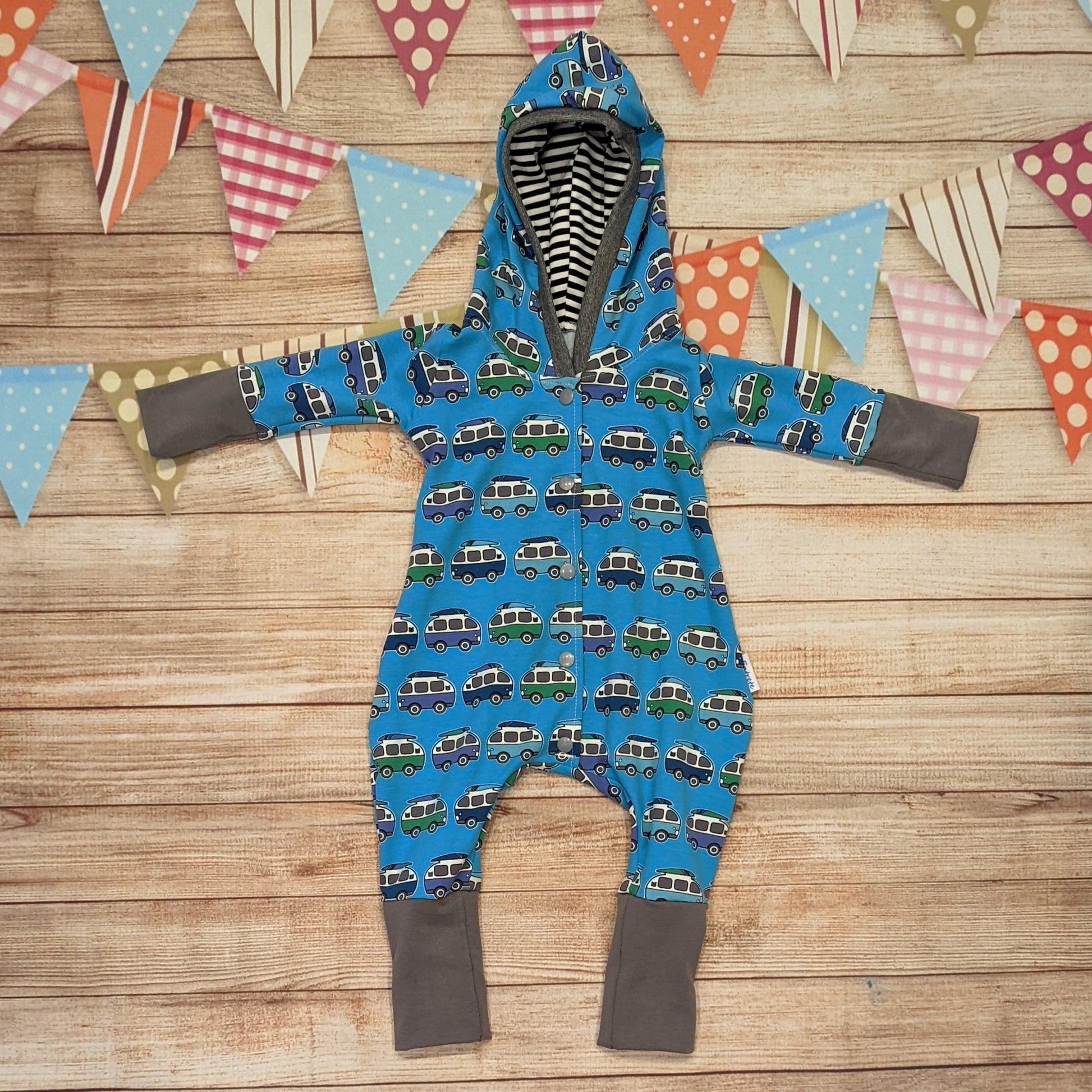 Kids hooded long sleeve romper, handmade using blue surf campervan cotton jersey, contrasting grey cotton jersey cuffs, grey ribbing around the hood and striped hood lining. 