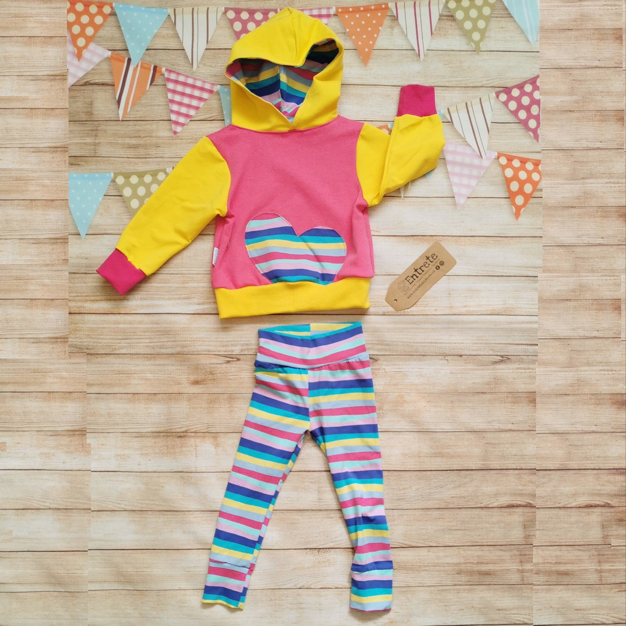 Girls pink and yellow hoodie, with cerise rainbow striped heart detailing, shown as an outfit with cerise rainbow striped leggings (sold separately)