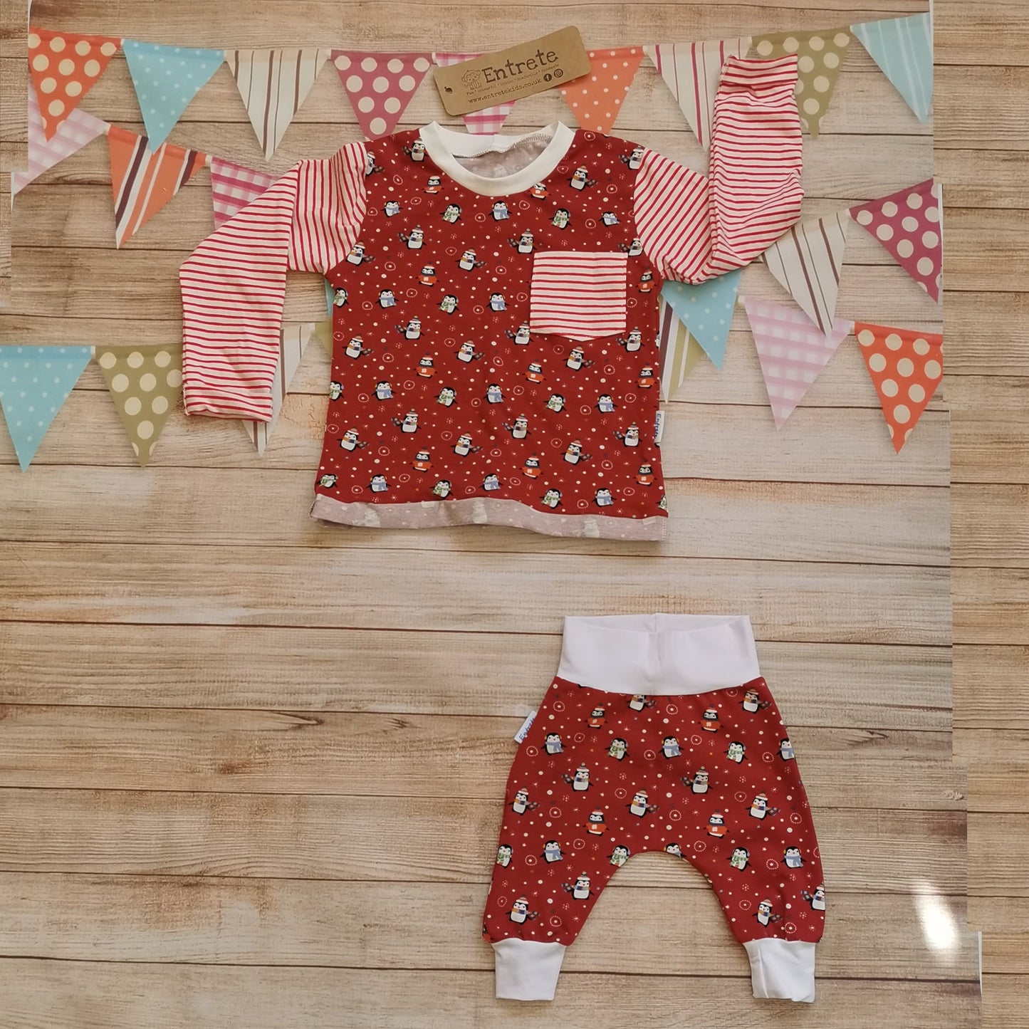 The fun Christmas penguins top shown as a set with matching red penguins harem pants. (sold separately)