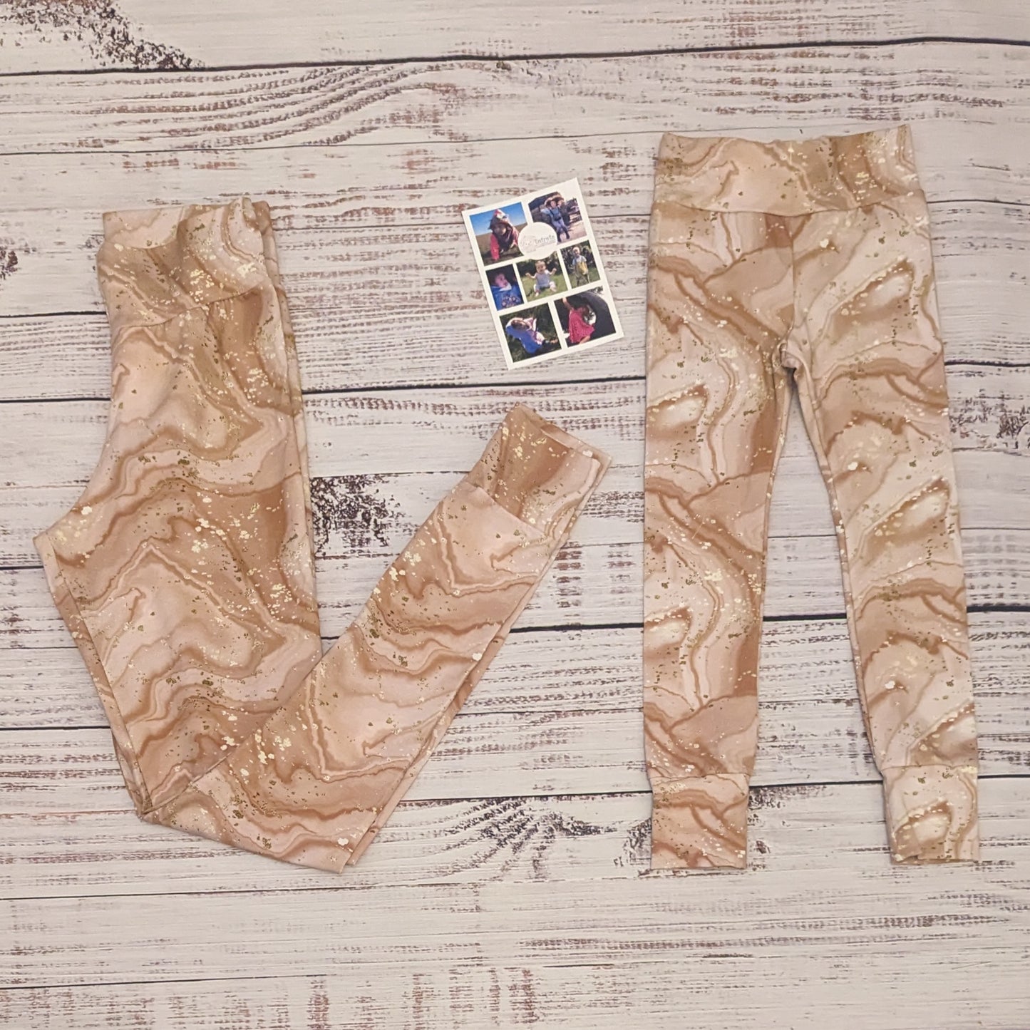 Dusty pink marble mama and mini leggings, that have an iced coffee appearance. Handmade using dusty pink marble cotton jersey. Shown folded.