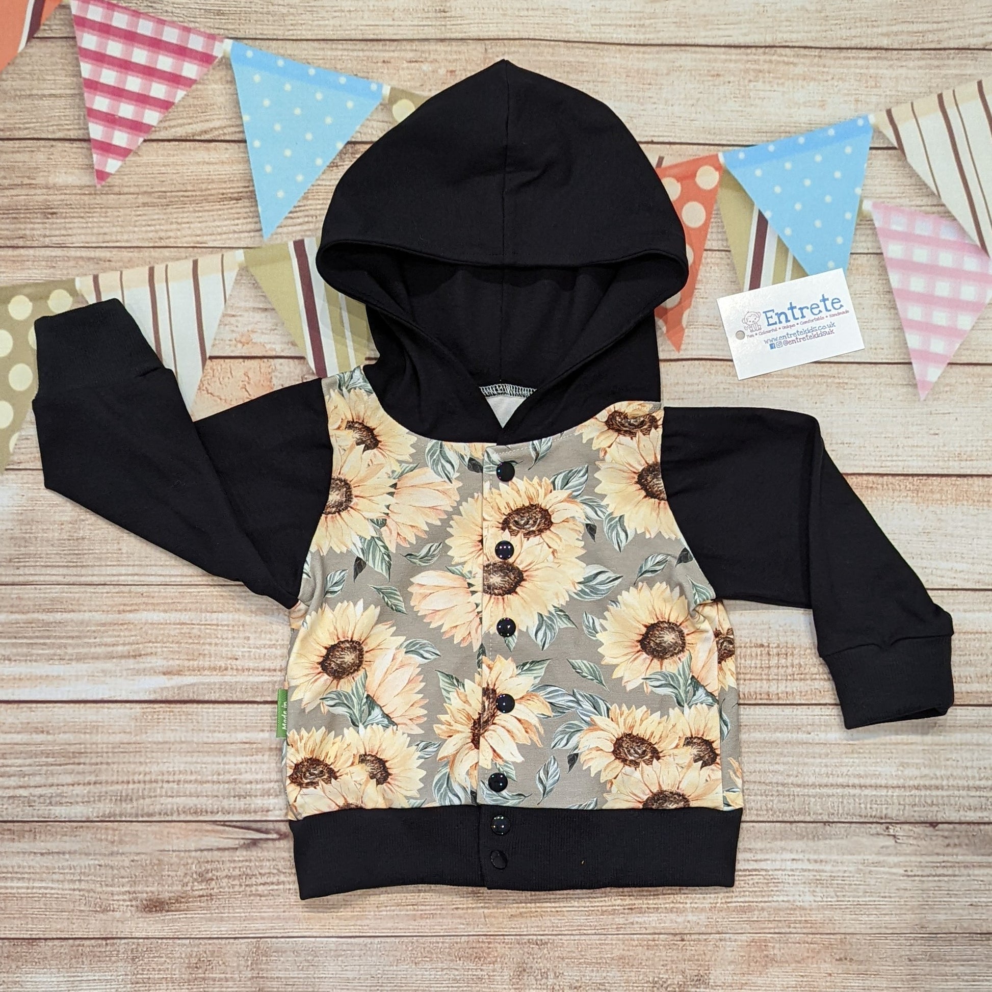 The gorgeous sunflower popper hoodie. Handmade using sunflowers cotton French terry, black cotton jersey and black cotton ribbing.