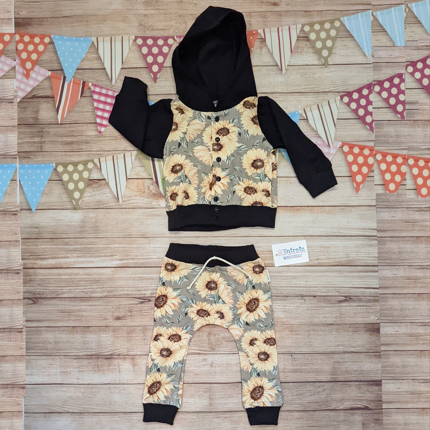 The gorgeous unisex sunflower popper hoodie shown as an outfit with matching harem joggers.