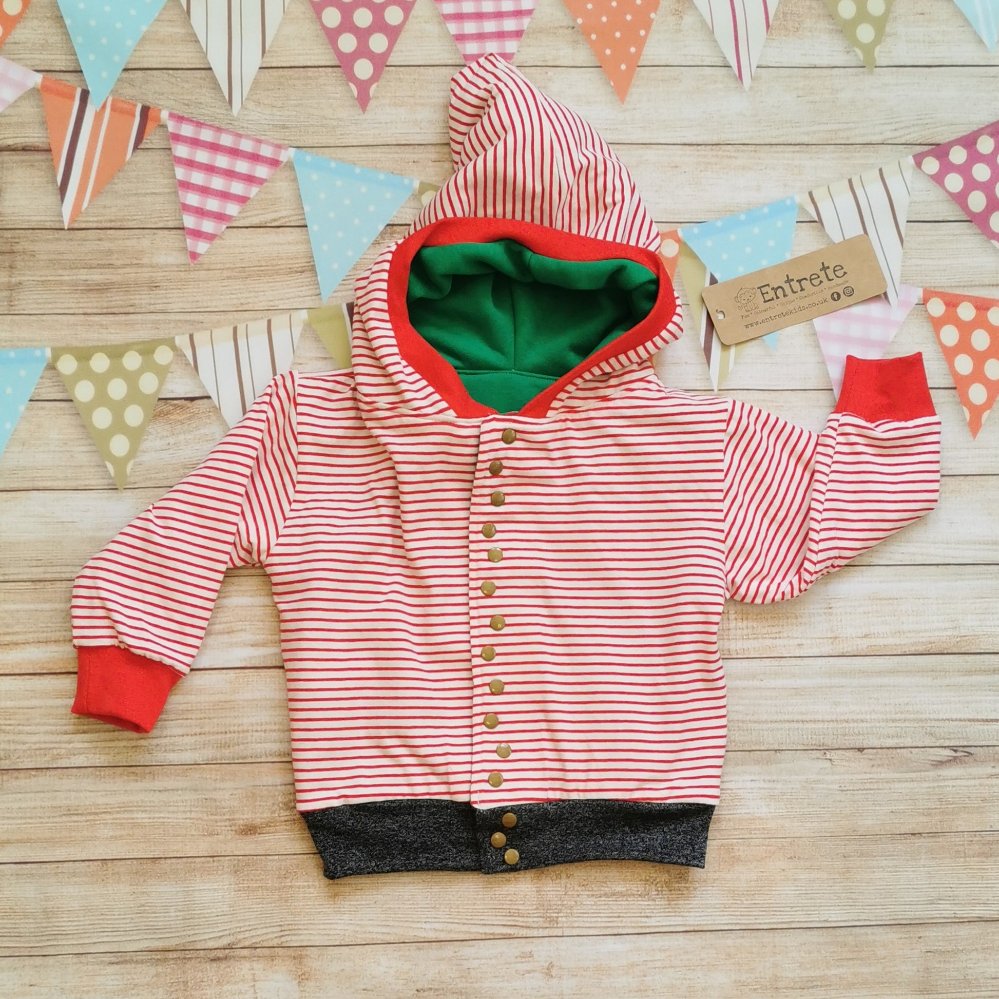 The reverse side of the fantastically fun elf hoodie. A classic hoodie handmade in red striped cotton jersey, red and graphite ribbing.