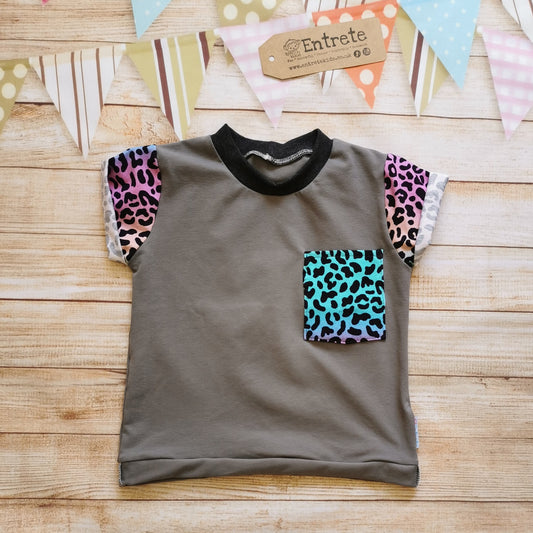 Short sleeve T-shirt, handmade using grey cotton jersey offset by stunning rainbow leopard print cotton jersey. Featuring a contrasting front pocket , rolled waist and cuffs and a ribbed neck.