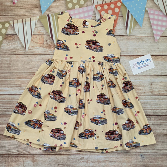 The fun retro hippie cars girls dress, handmade using light yellow hippie cars cotton jersey. Sleeveless model shown.