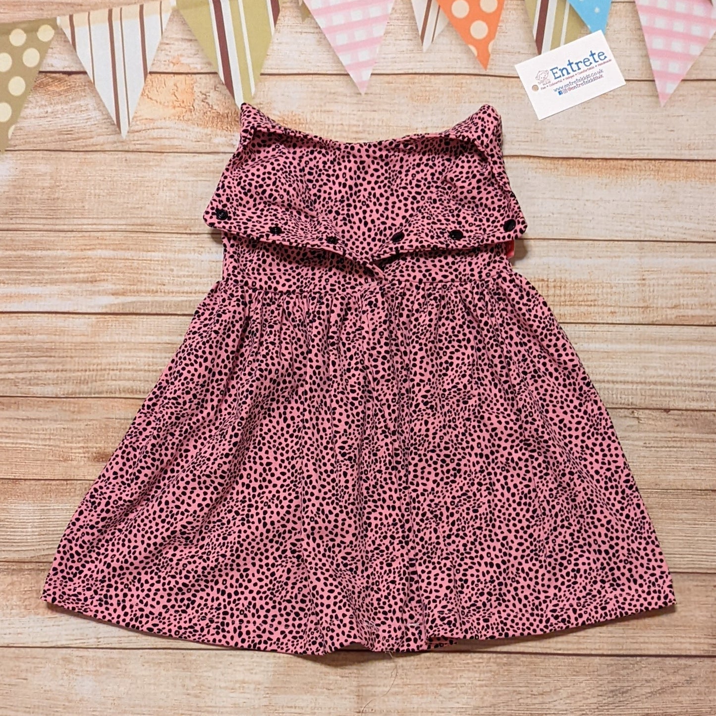 The deliciously stylish pink cheetah sleeveless dress. Handmade using pink cheetah print cotton jersey. Shown with the back popper entry open. Sizes below 9 months have poppers the length of the dress for easier changes.