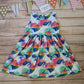 The gorgeously colourful unicorns on white sleeveless girls dress. Handmade using unicorns on white cotton jersey.