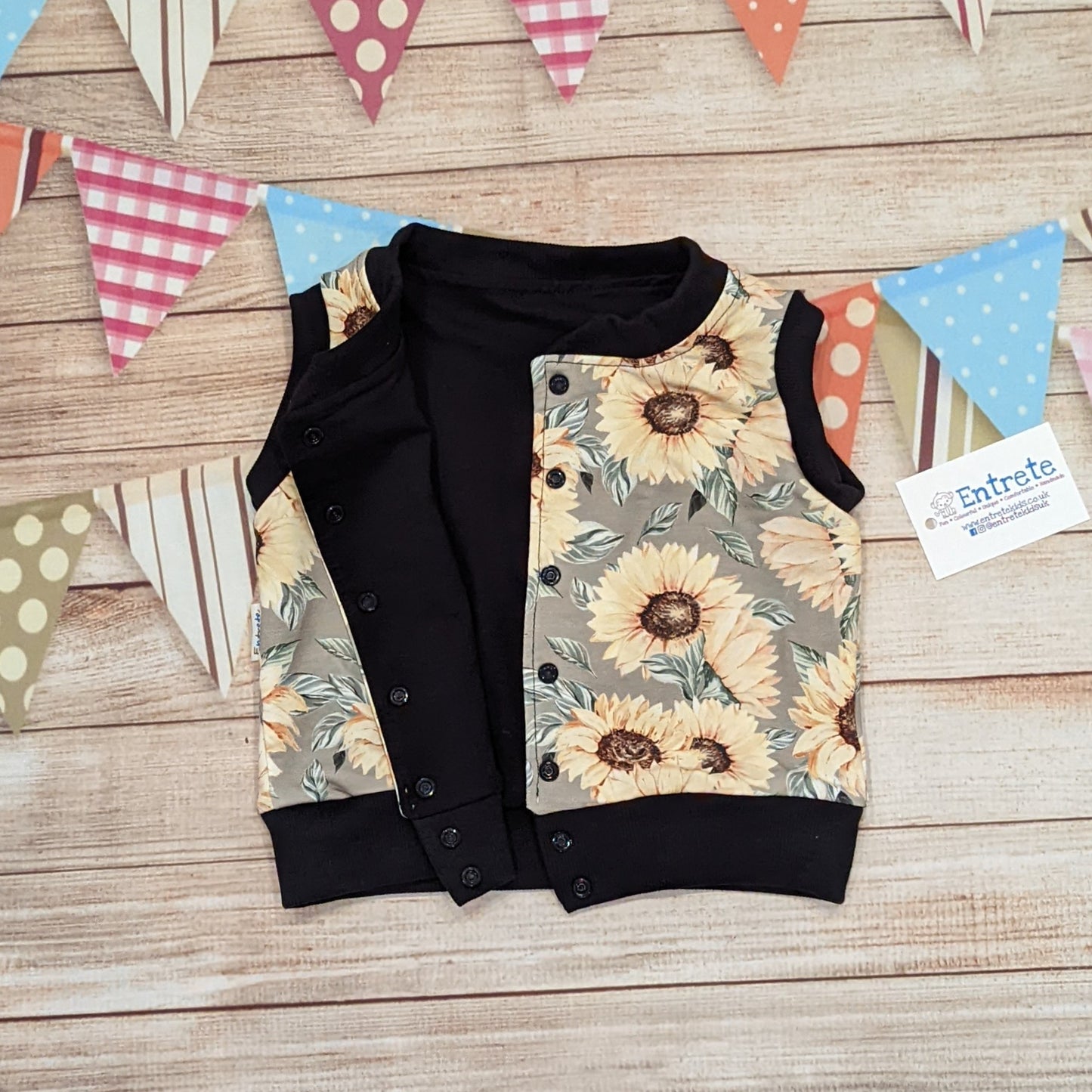 The gorgeous sunflowers sleeveless popper sweatshirt. Handmade using sunflowers cotton French terry, black cotton jersey and black cotton ribbing. Shown with popper entry open.