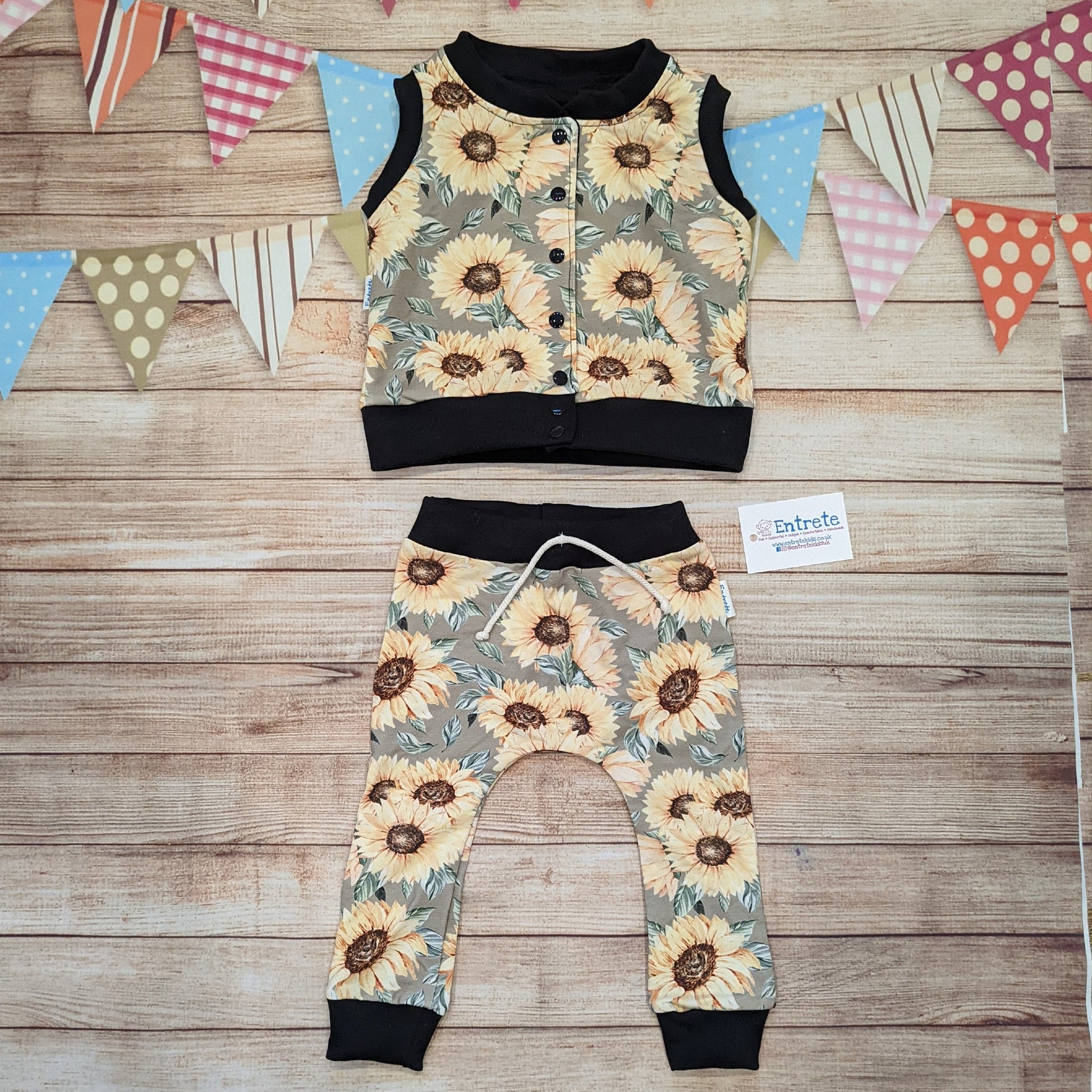 The gorgeous sunflowers sleeveless popper sweatshirt. Shown as an outfit with a pair of matching harem joggers.