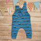 The epic blue surf campervan sleeveless romper. Handmade using blue surf campervan cotton jersey. Shown with one shoulder popper entry open.