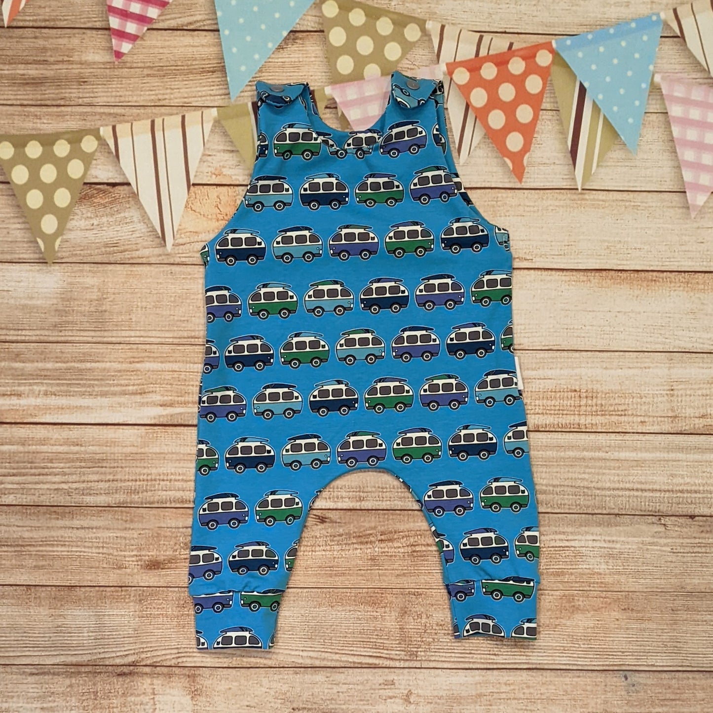 The epic blue surf campervan sleeveless romper. Handmade using blue surf campervan cotton jersey.