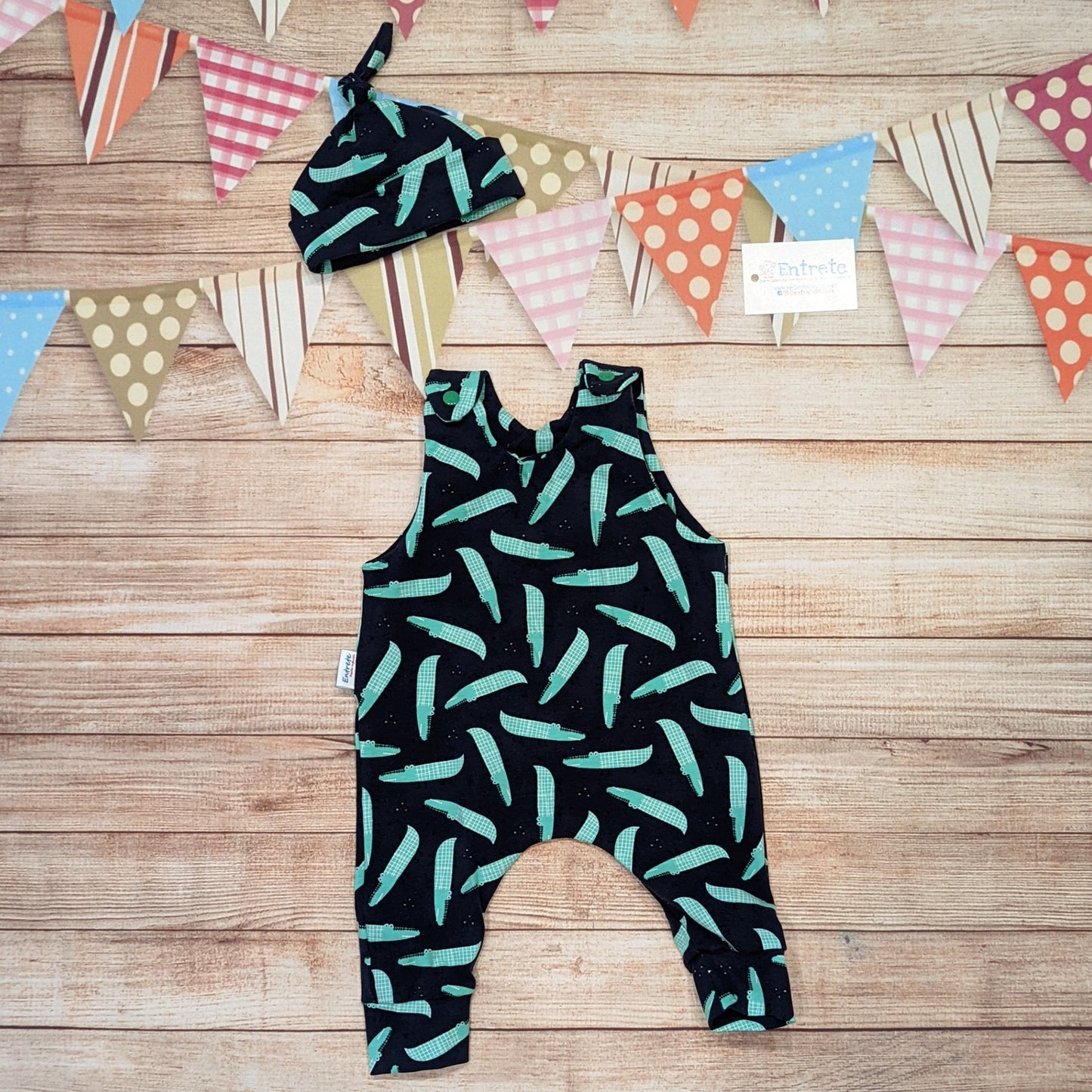 Cool crocodiles sleeveless romper, handmade using navy crocodiles cotton jersey. Shown with a matching tie top hat (sold separately).