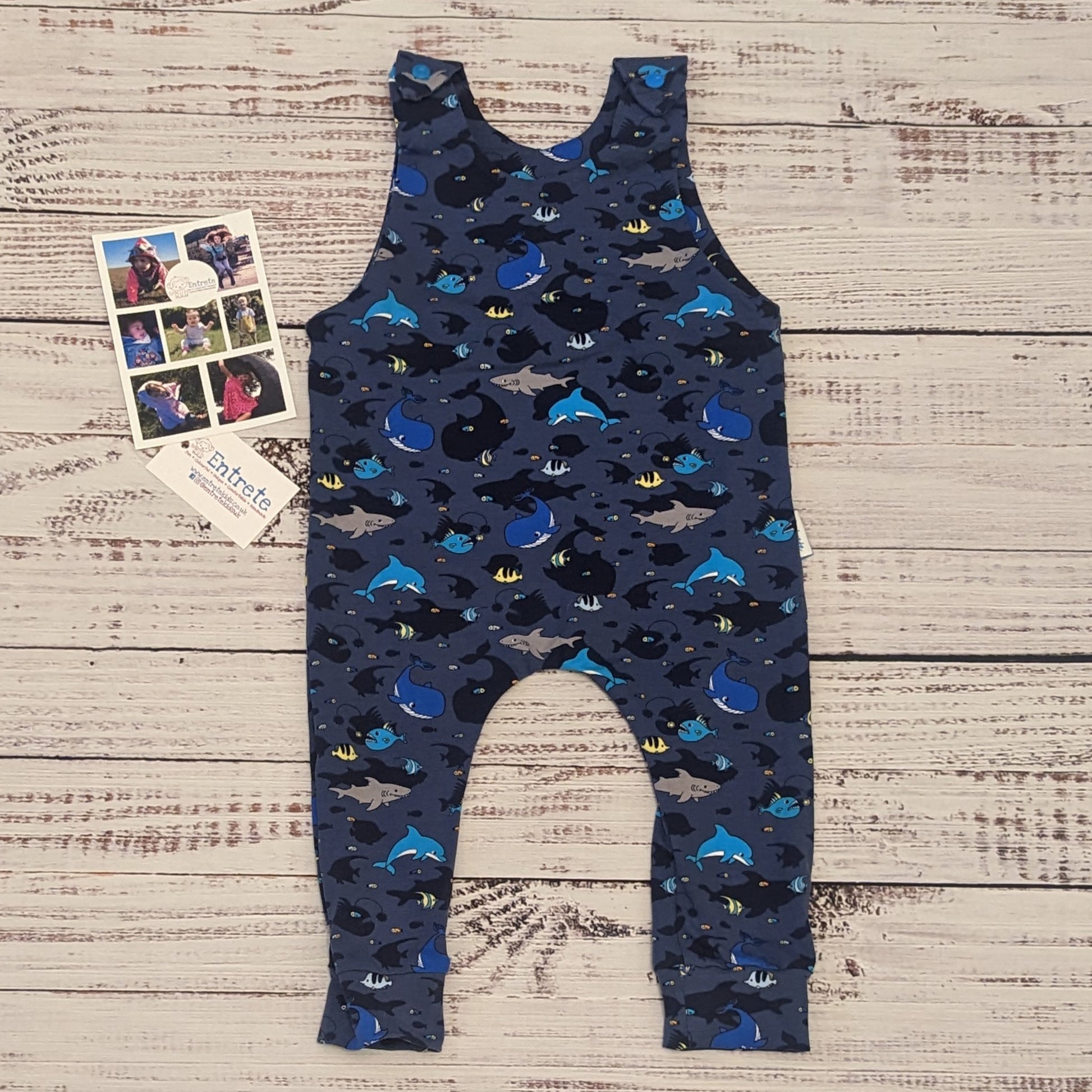 Kids sea life sleeveless romper, packed full of fun marine life. Handmade using navy sea life shadows cotton jersey.