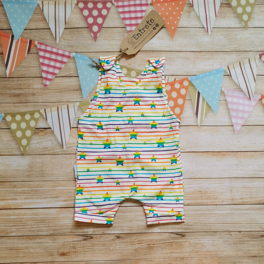 Front of unisex kids romper shorts, handmade using stunning rainbow stars cotton jersey.