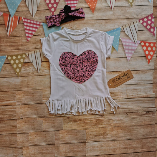 Girls tassel T-shirt, handmade with white cotton jersey and stunning pink cheetah print heart detailing. With rolled sleeves and tassels to the waist. Shown with matching headband (sold separately).